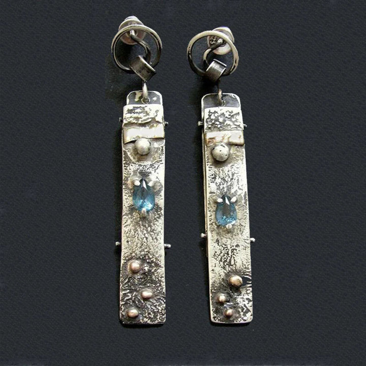 Boucles d'oreilles en pierre bleue faites à la main