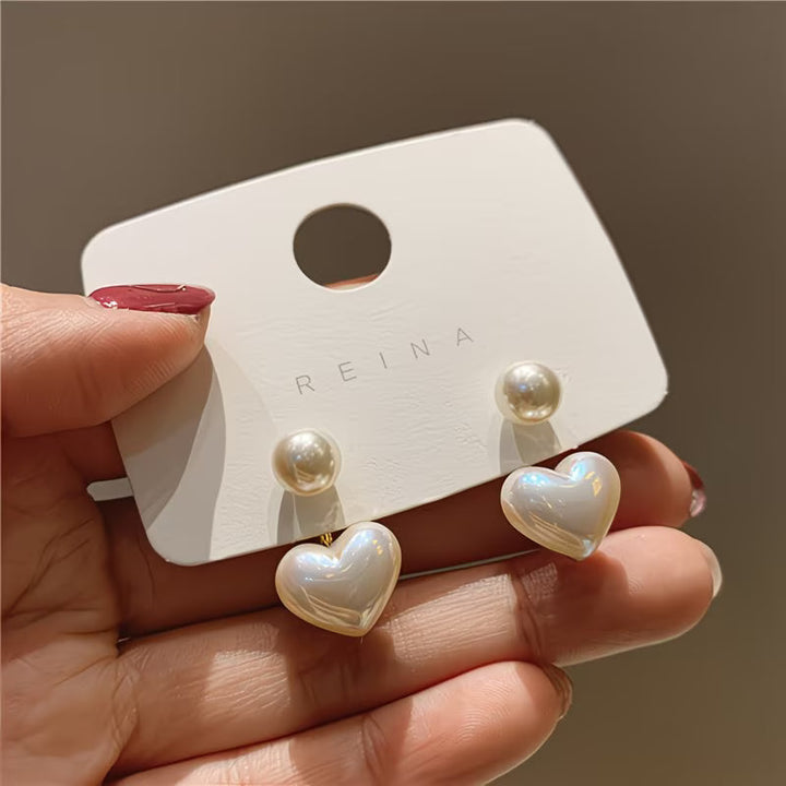 Boucles d'oreilles en forme de cœur avec double perle
