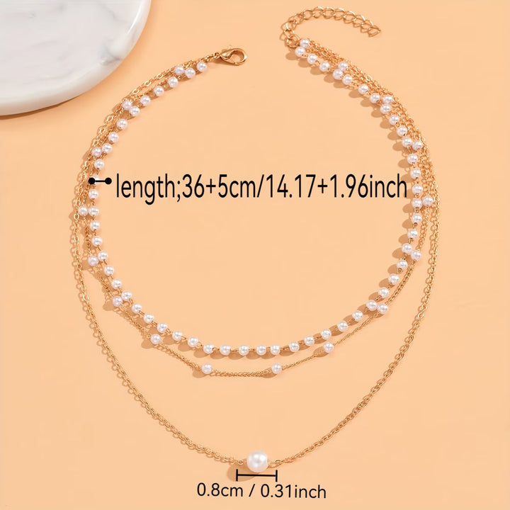 Le collier en couches de perles Trinity
