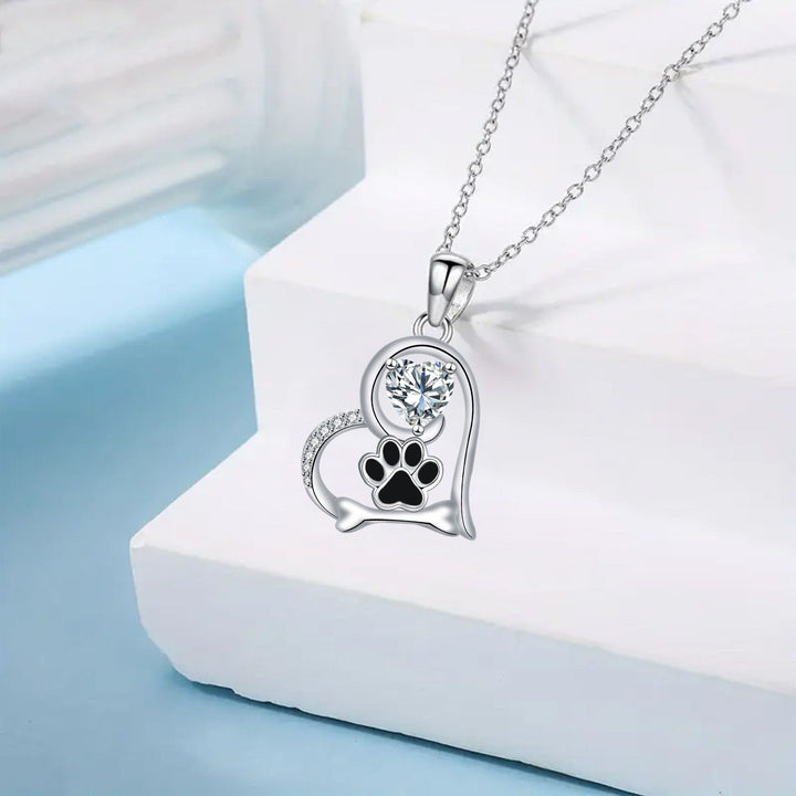 Collier en argent fait main avec empreinte de patte de chien et os en zirconium