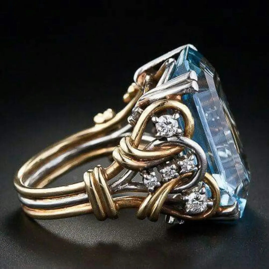 Bague en or doré à couches avec zirconia bleu vintage