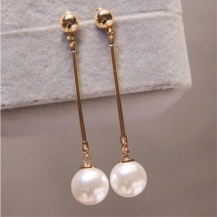 Boucles d'oreilles pendantes de luxe avec des perles plaquées à la main