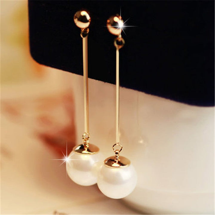 Boucles d'oreilles pendantes de luxe avec des perles plaquées à la main spéciales