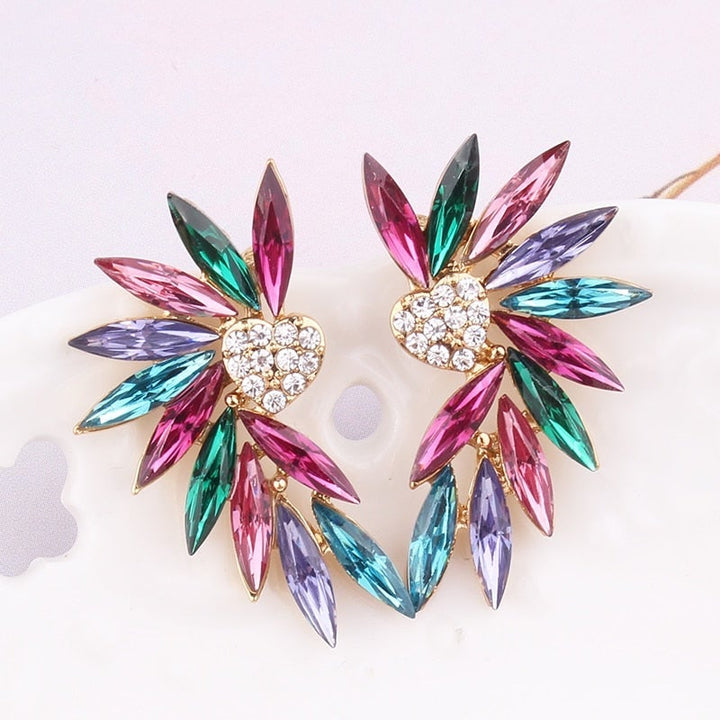 Boucles d'oreilles ailes de cœur avec zirconias