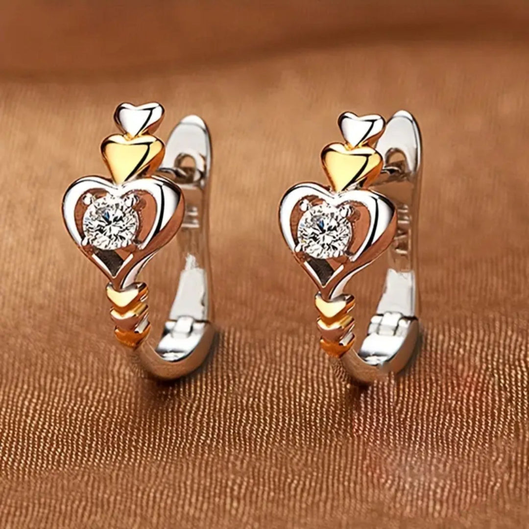Boucles d'oreilles créoles en or et argent avec zirconia en forme de cœur