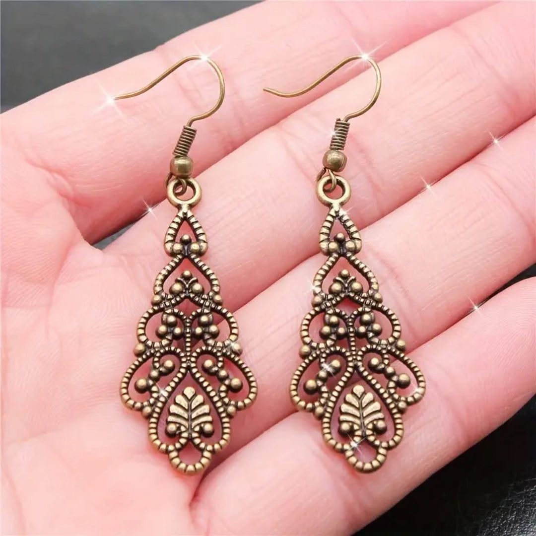 Boucles d'oreilles en mandala doré pendantes