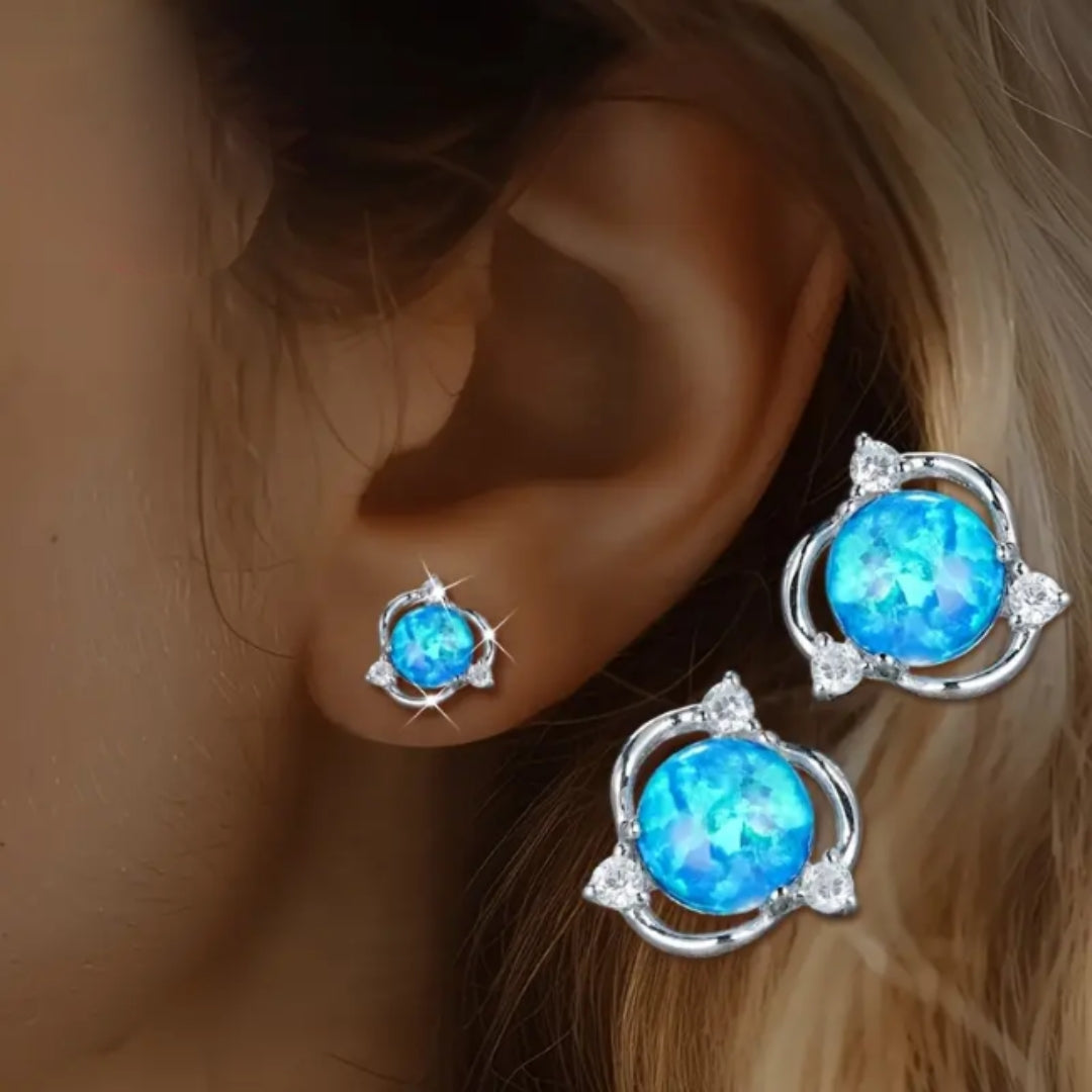Boucles d'oreilles en argent avec opale bleue en orbite