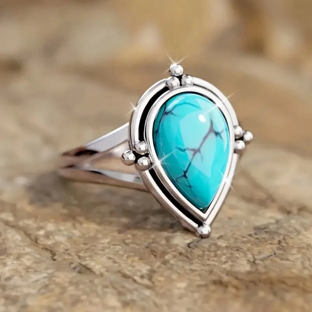 Bague en argent avec pierre ovale bleue incrustée