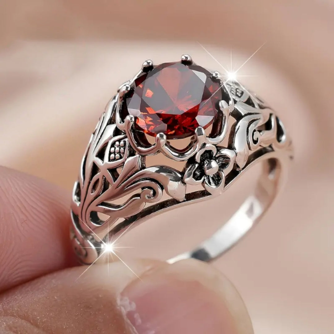 Bague en argent creux avec zircon rouge
