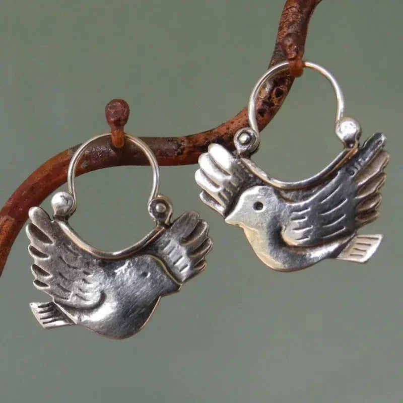 Boucles d'oreilles pendantes inspirées des oiseaux bohèmes – Ton argent