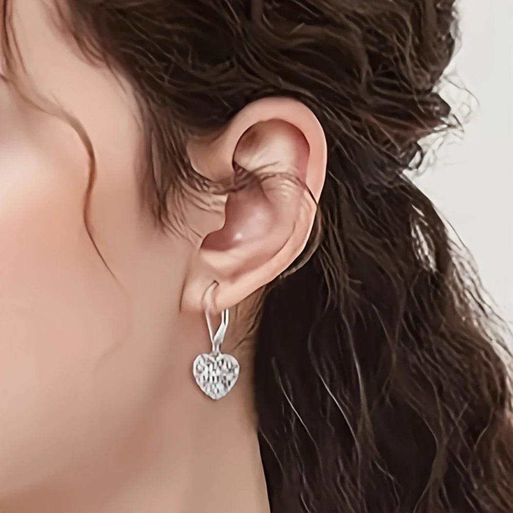 Boucles d'oreilles en forme de cœur creux en argent
