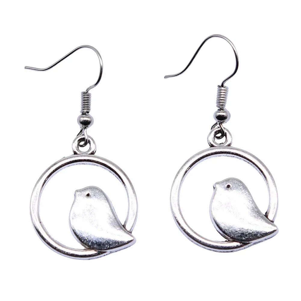 Boucles d'oreilles pendantes avec charme d'oiseau vintage – Bijoux boho faits main