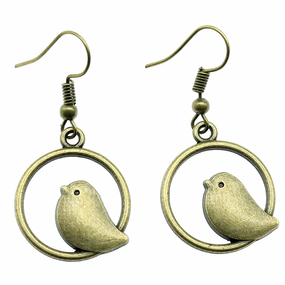 Boucles d'oreilles pendantes avec charme d'oiseau vintage – Bijoux boho faits main