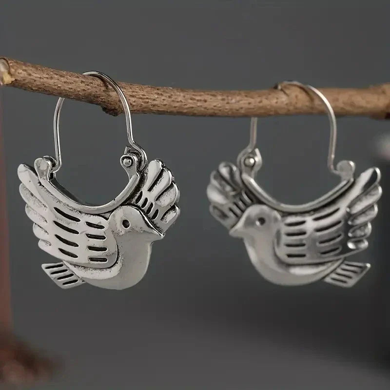 Boucles d'oreilles pendantes inspirées des oiseaux bohèmes – Ton argent