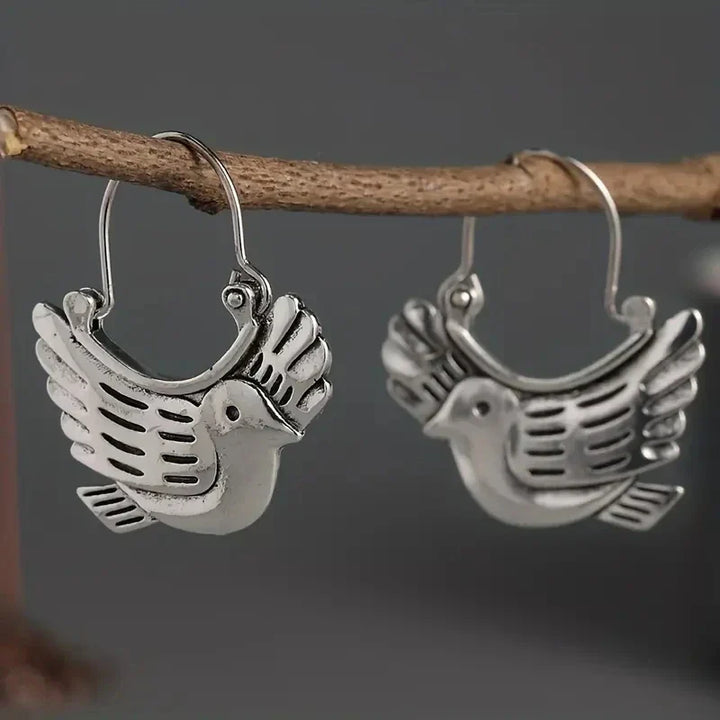 Boucles d'oreilles pendantes inspirées des oiseaux bohèmes – Ton argent