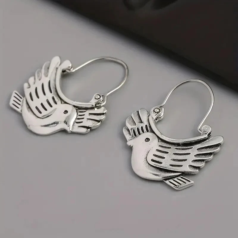 Boucles d'oreilles pendantes inspirées des oiseaux bohèmes – Ton argent