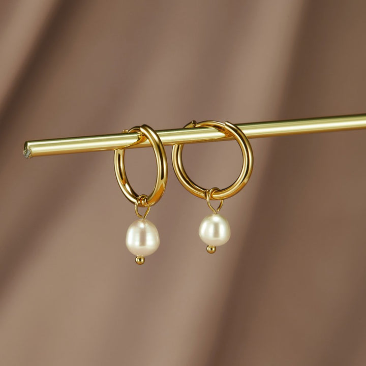 Boucles d'oreilles créoles en perles essentielles