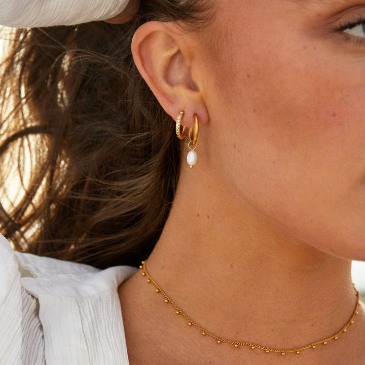 Boucles d'oreilles créoles en perles essentielles
