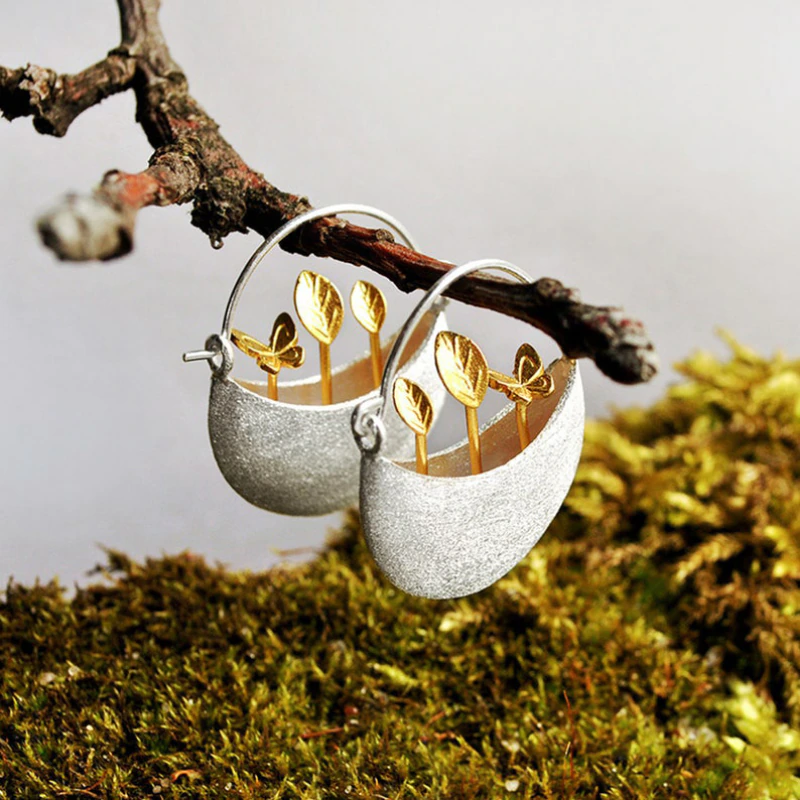 Boucles d'oreilles en argent avec panier floral plaqué or