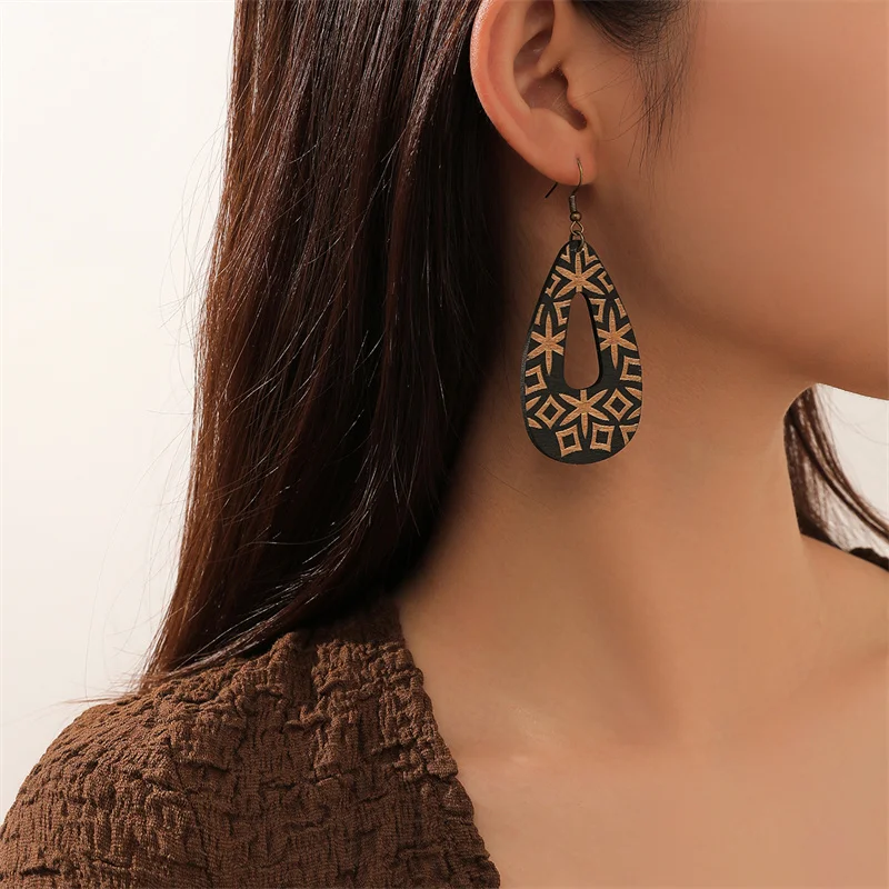 Boucles d'oreilles pendantes creuses noires vintage