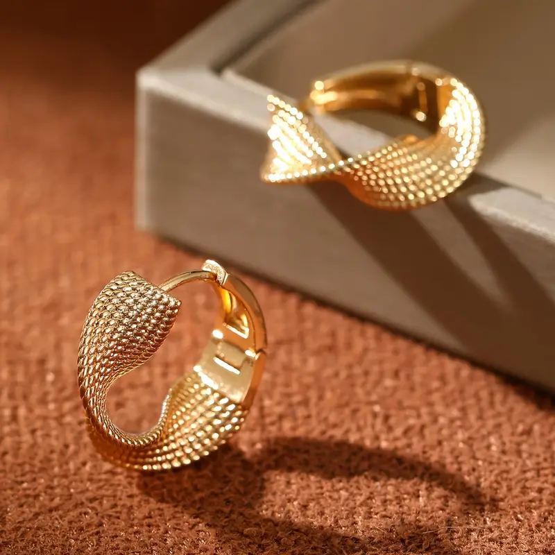 Boucles d'oreilles créoles ondulées brillantes