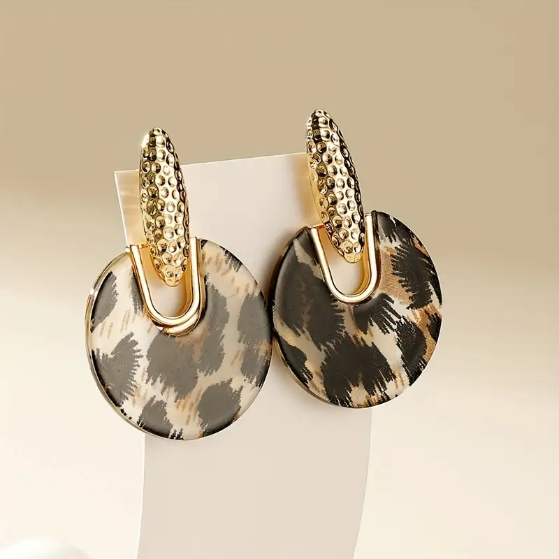 Boucles d'oreilles dorées à motif léopard arrondi