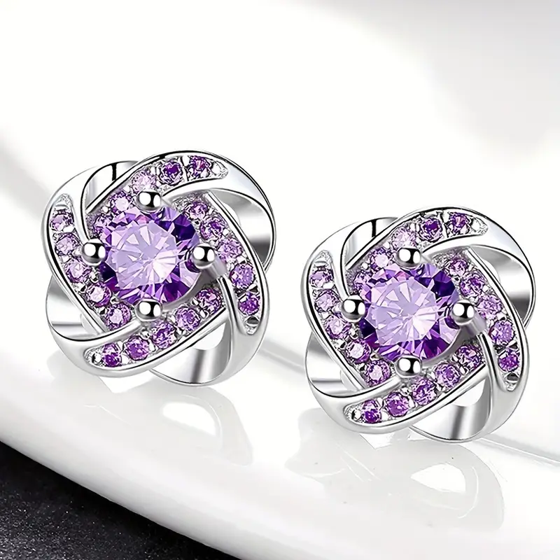 Boucles d'oreilles en zirconium violet en spirale