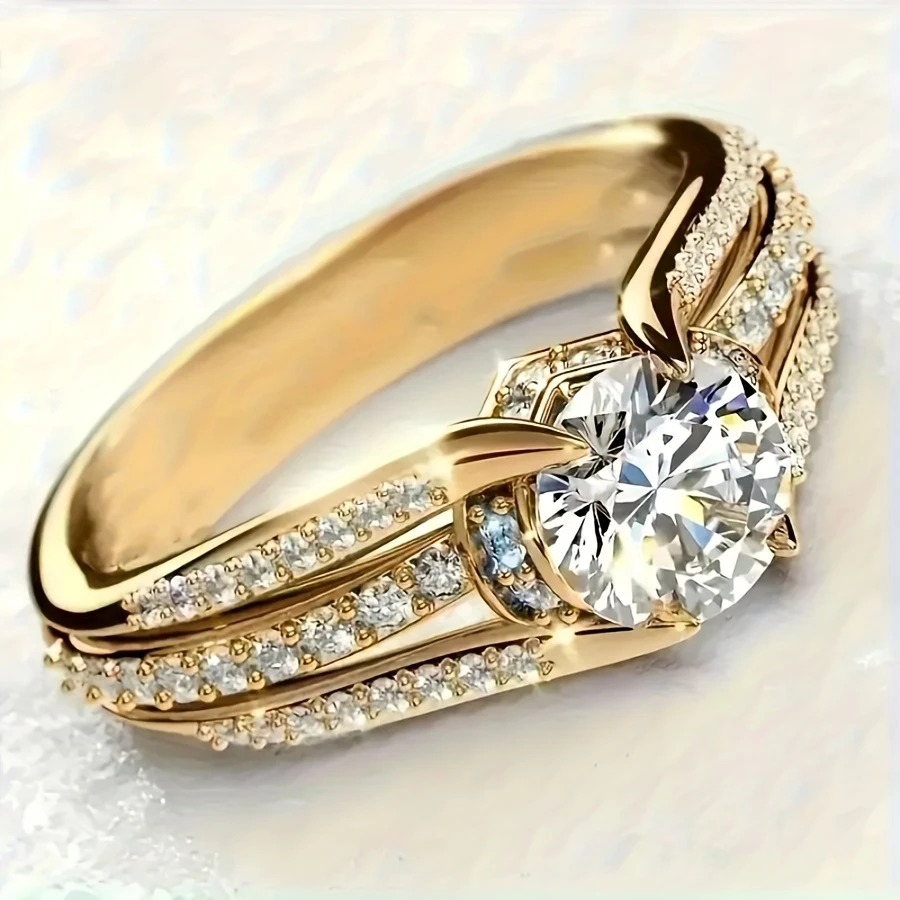 Bague dorée en cristal rond blanc