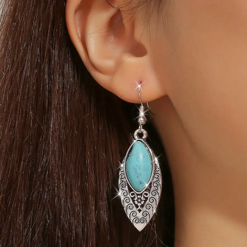 Boucles d'oreilles en argent brillant avec pierre bleue pendante
