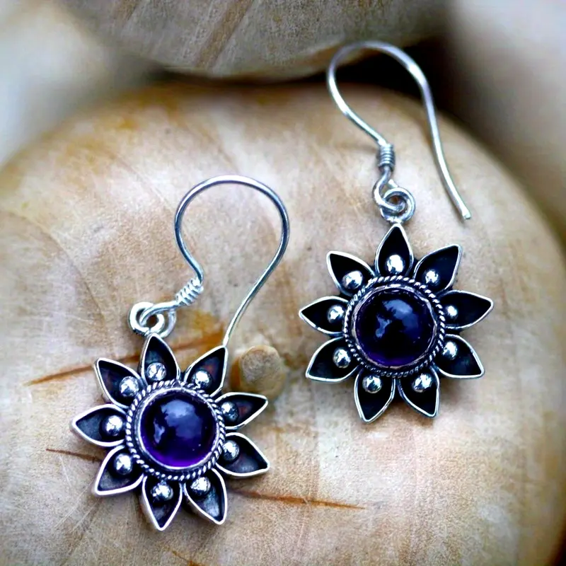 Boucles d'oreilles en argent avec pierre bleue et fleur
