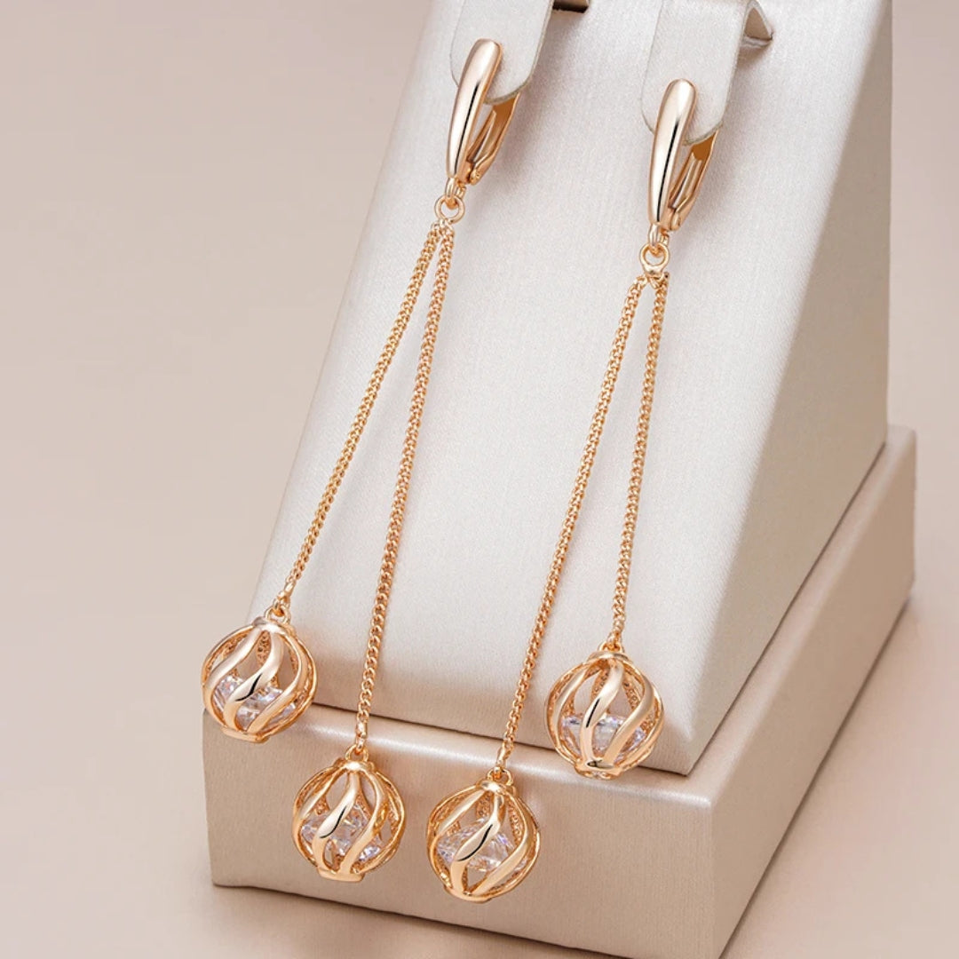 Boucles d'oreilles élégantes à sphères pendantes