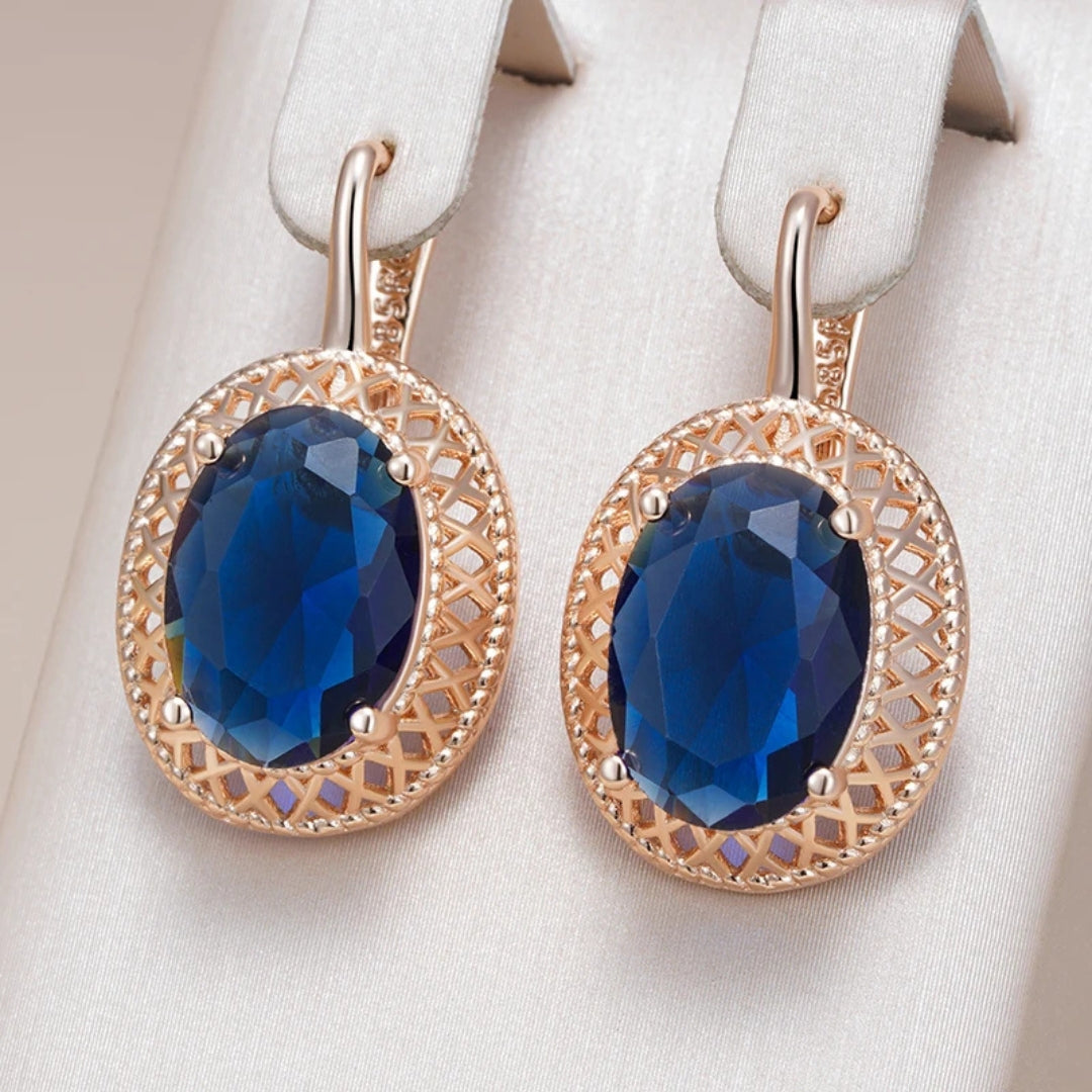 Boucles d'oreilles en cristal bleu élégant et arrondi