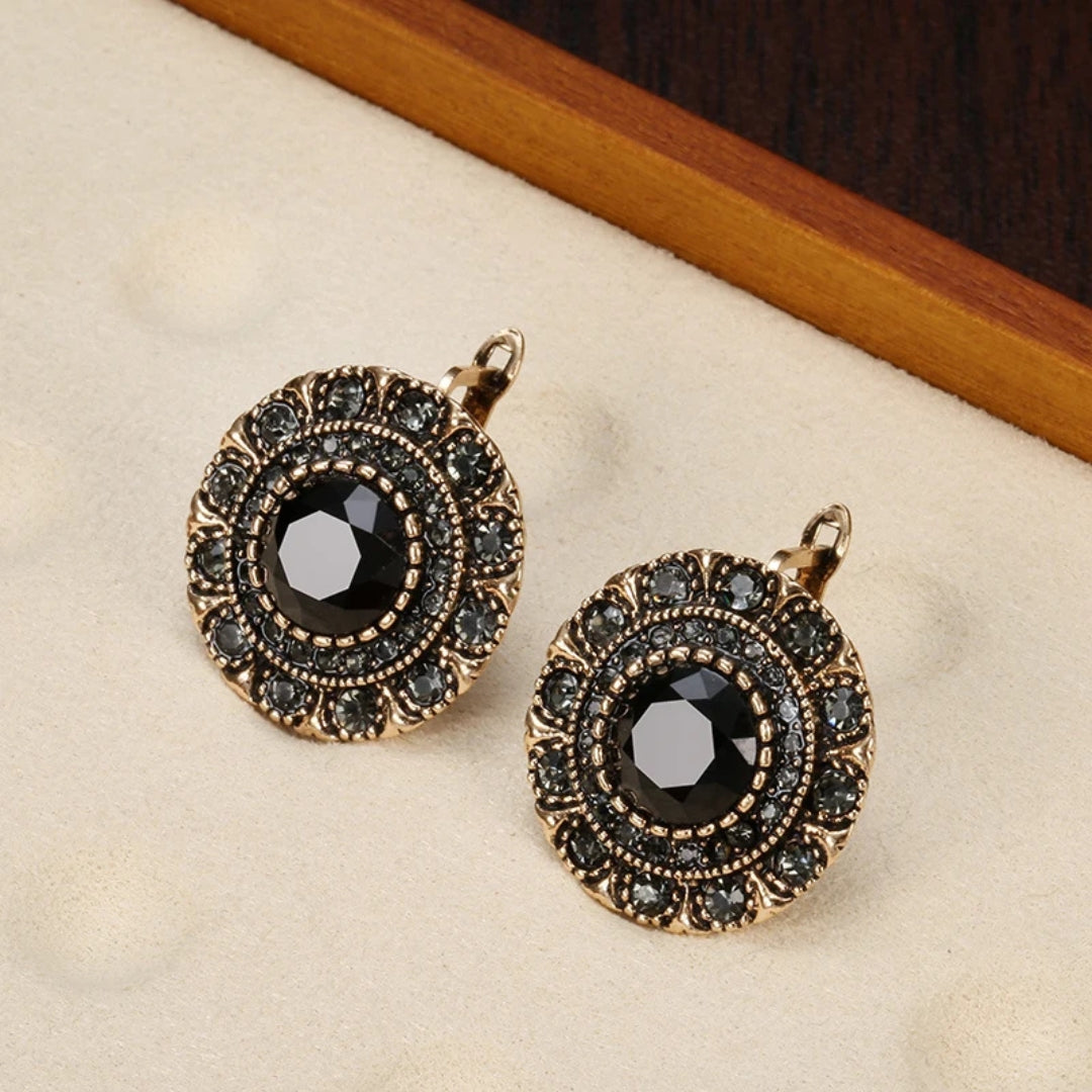 Boucles d'oreilles en cristal noir élégant et arrondi